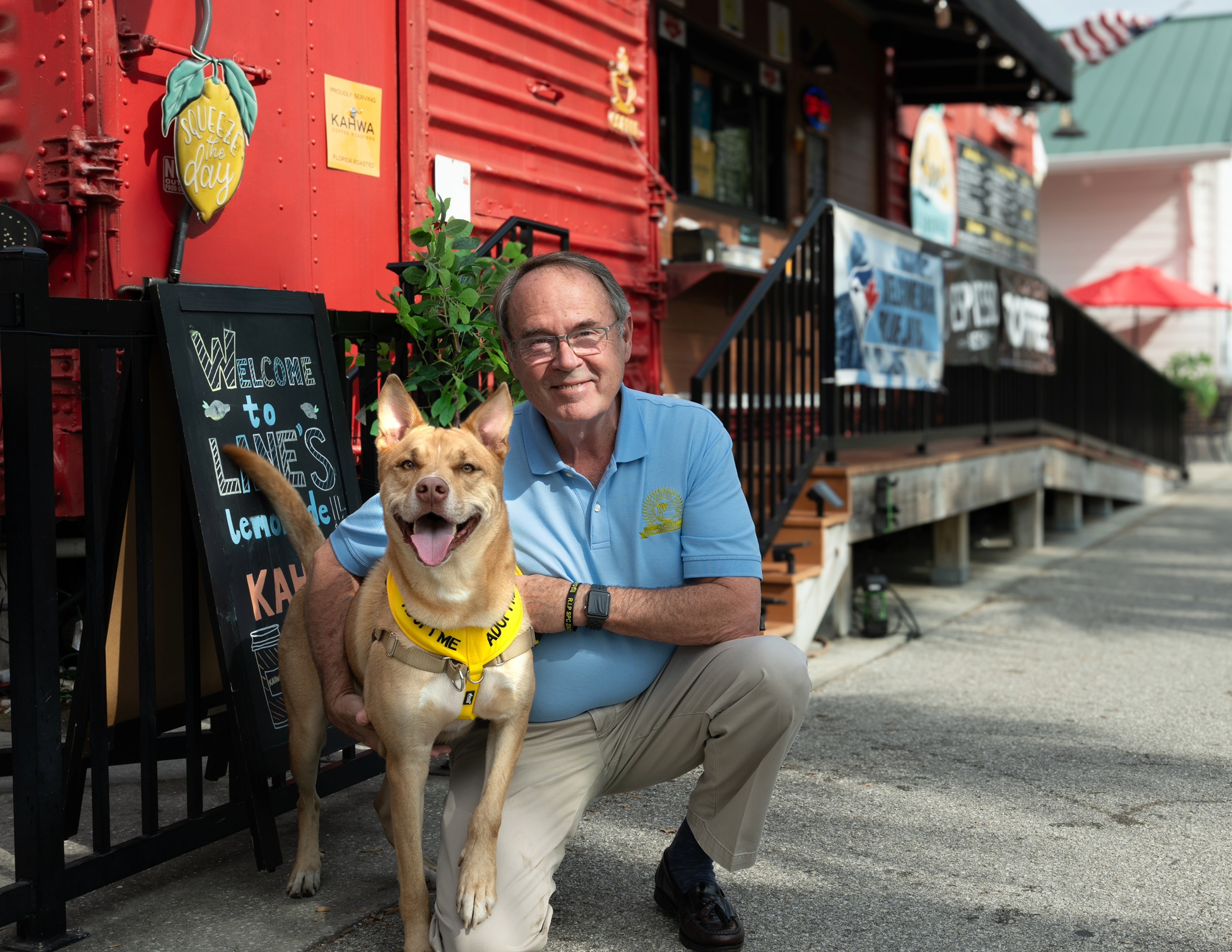 Dave Eggers with a dog at a local Dunedin business